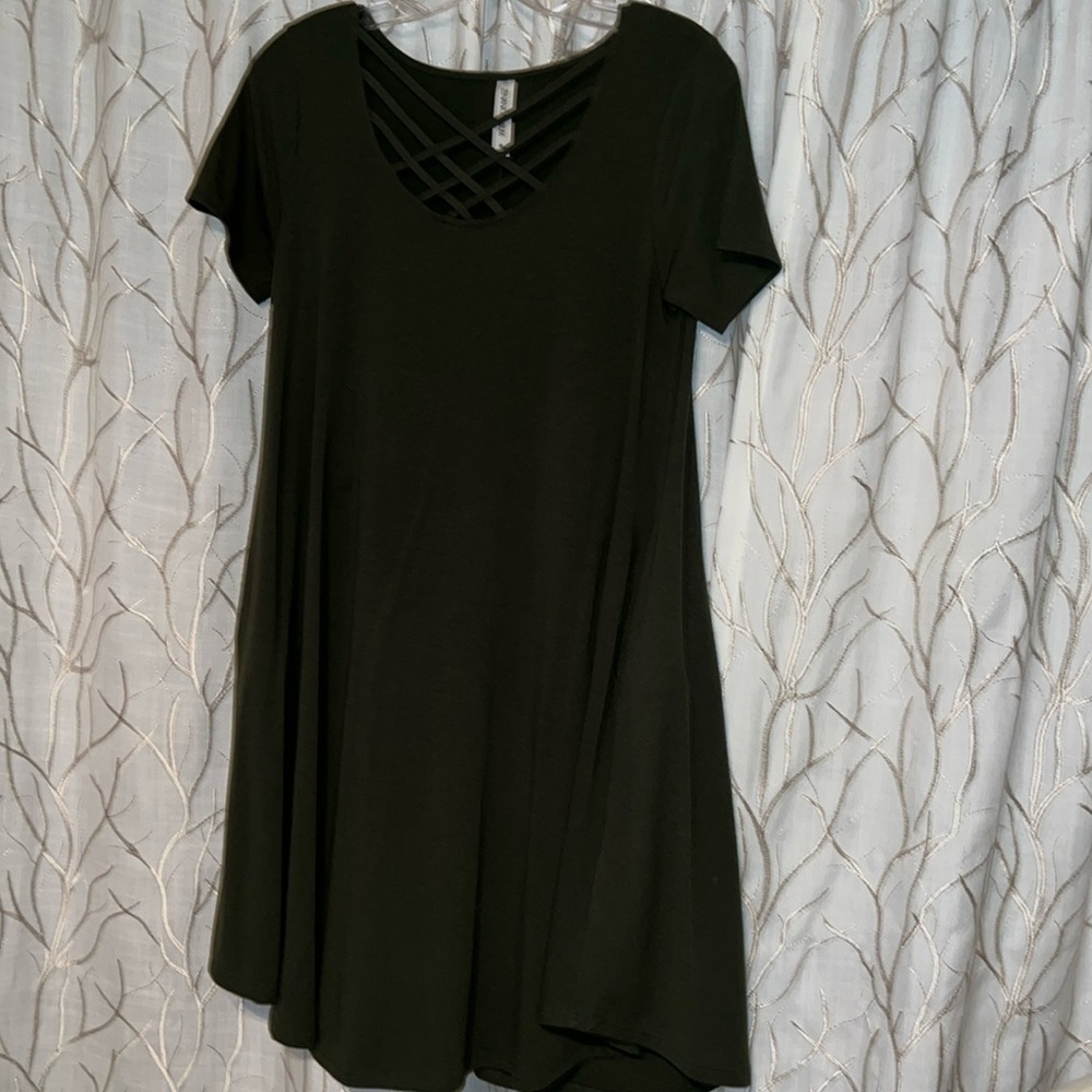 Dark green dress with Criss cross straps on chest.